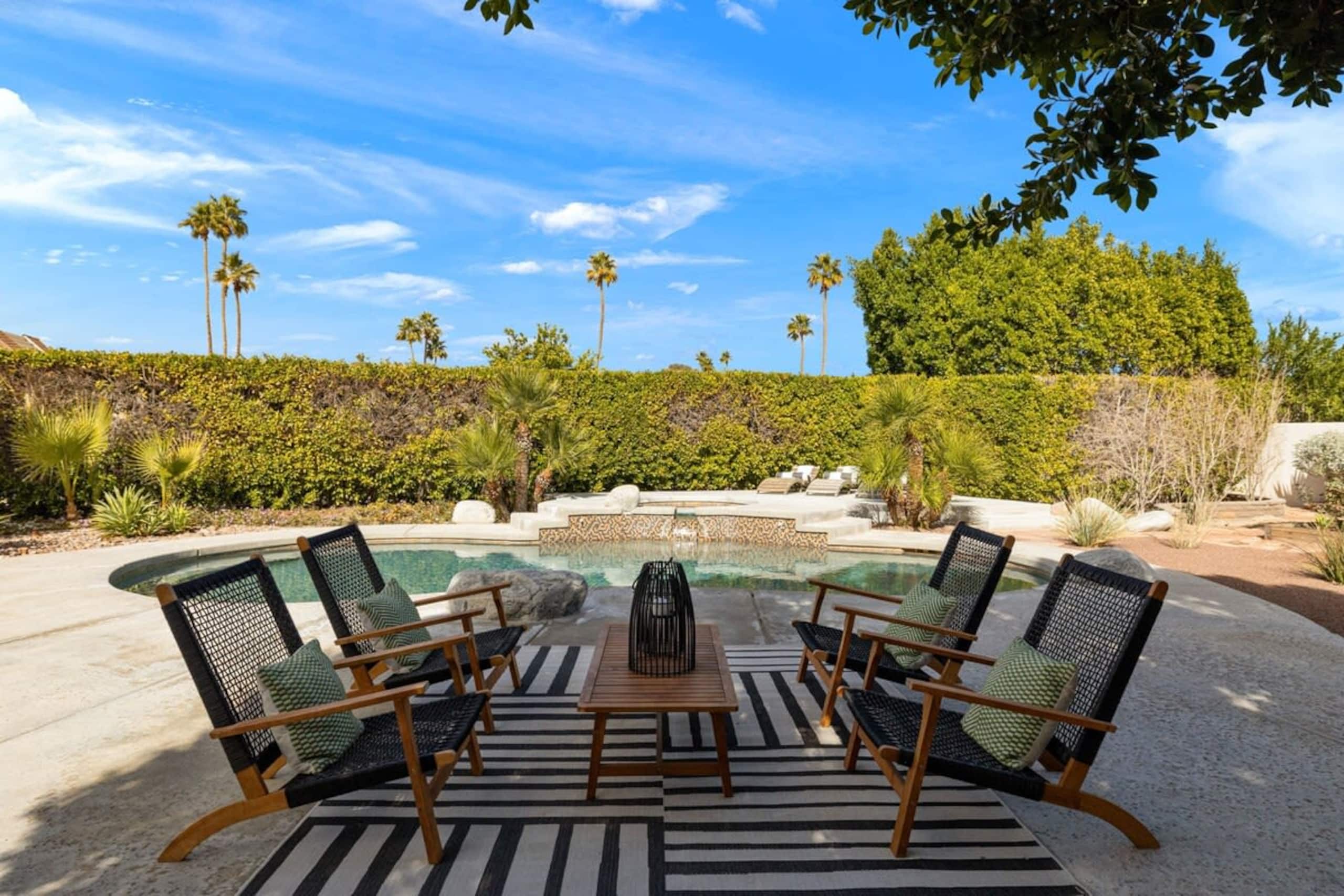 Fire pit lounge beside the pool