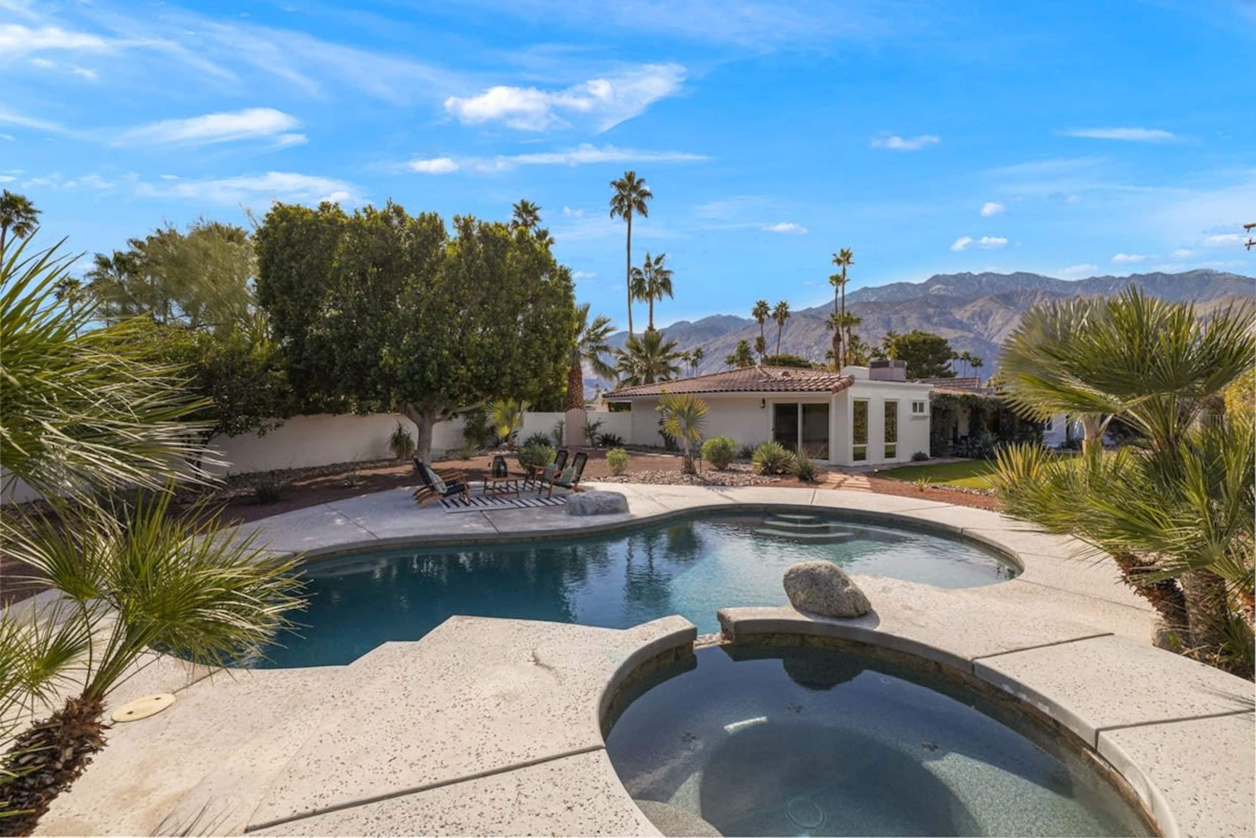 Pool and hot tub with palm trees and San Jacinto mountain views